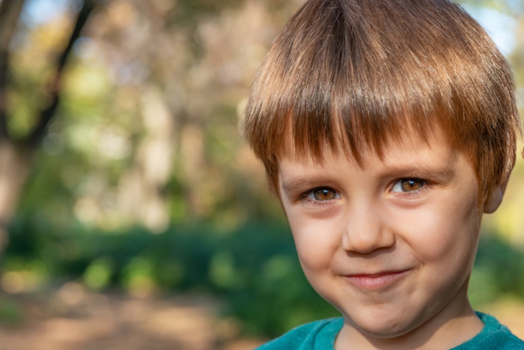 Young boy outside in autumn